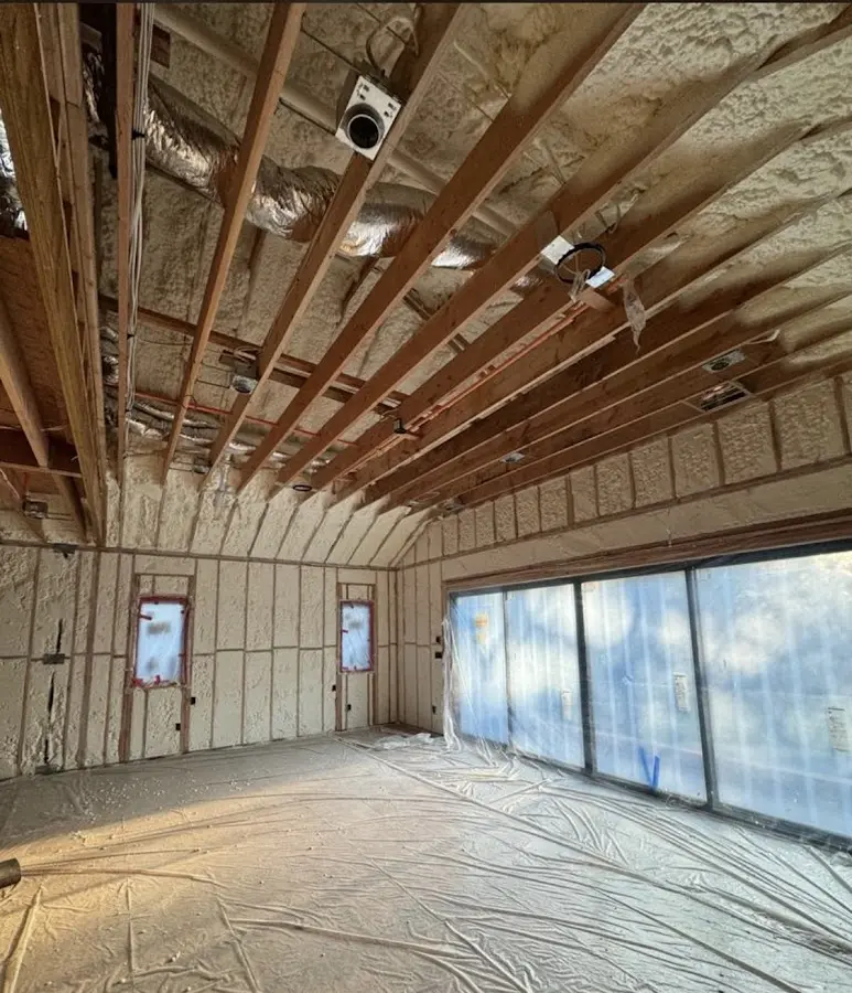 Interior walls and ceiling insulated with spray foam during new construction in Morrisville